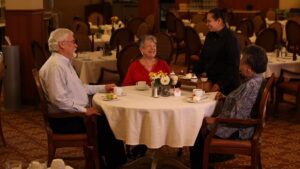 Evergreen Senior Living | Resident with family at table