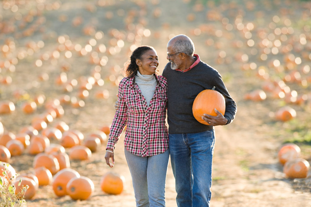 Seniors walking through a pumpkin patch